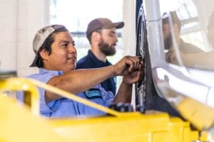 O'Hara Automotive employees working on tire alignment