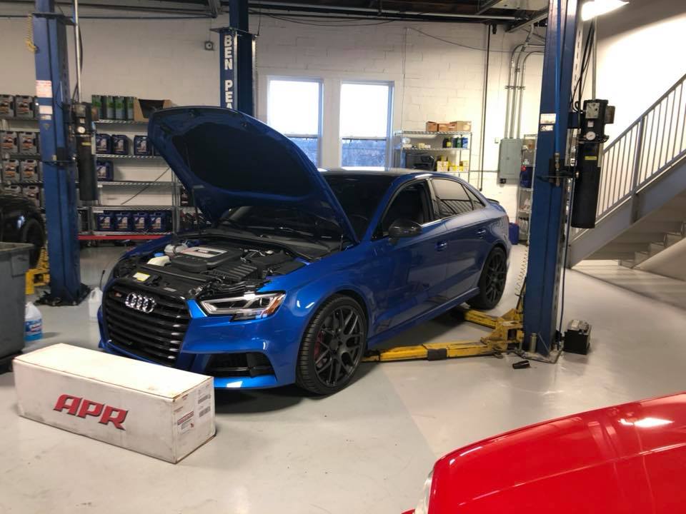 Blue Audi with open hood